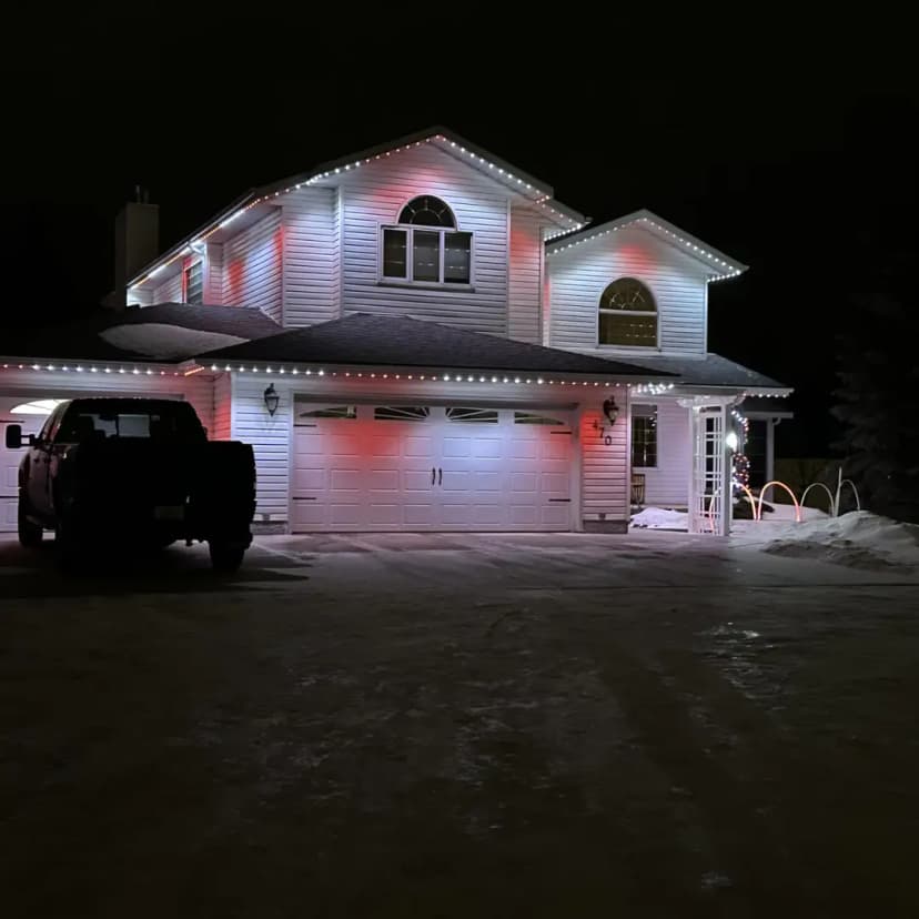 A home featuring Clear Lighting's LED lighting in a holiday candy cane-themed pattern of red and white.